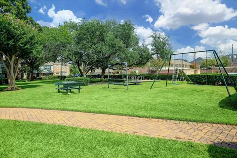 a view of a park with large trees