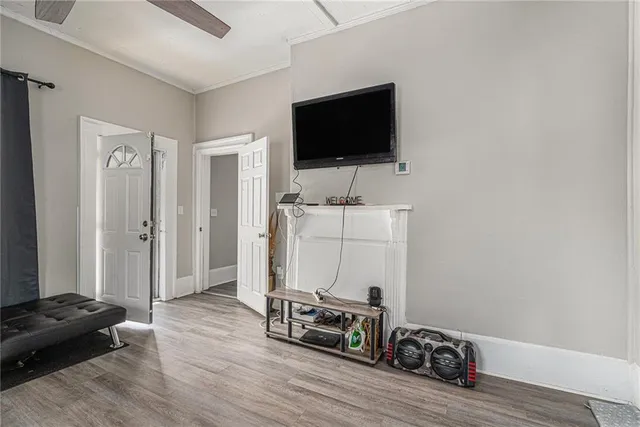 a view of a livingroom with furniture and a flat screen tv