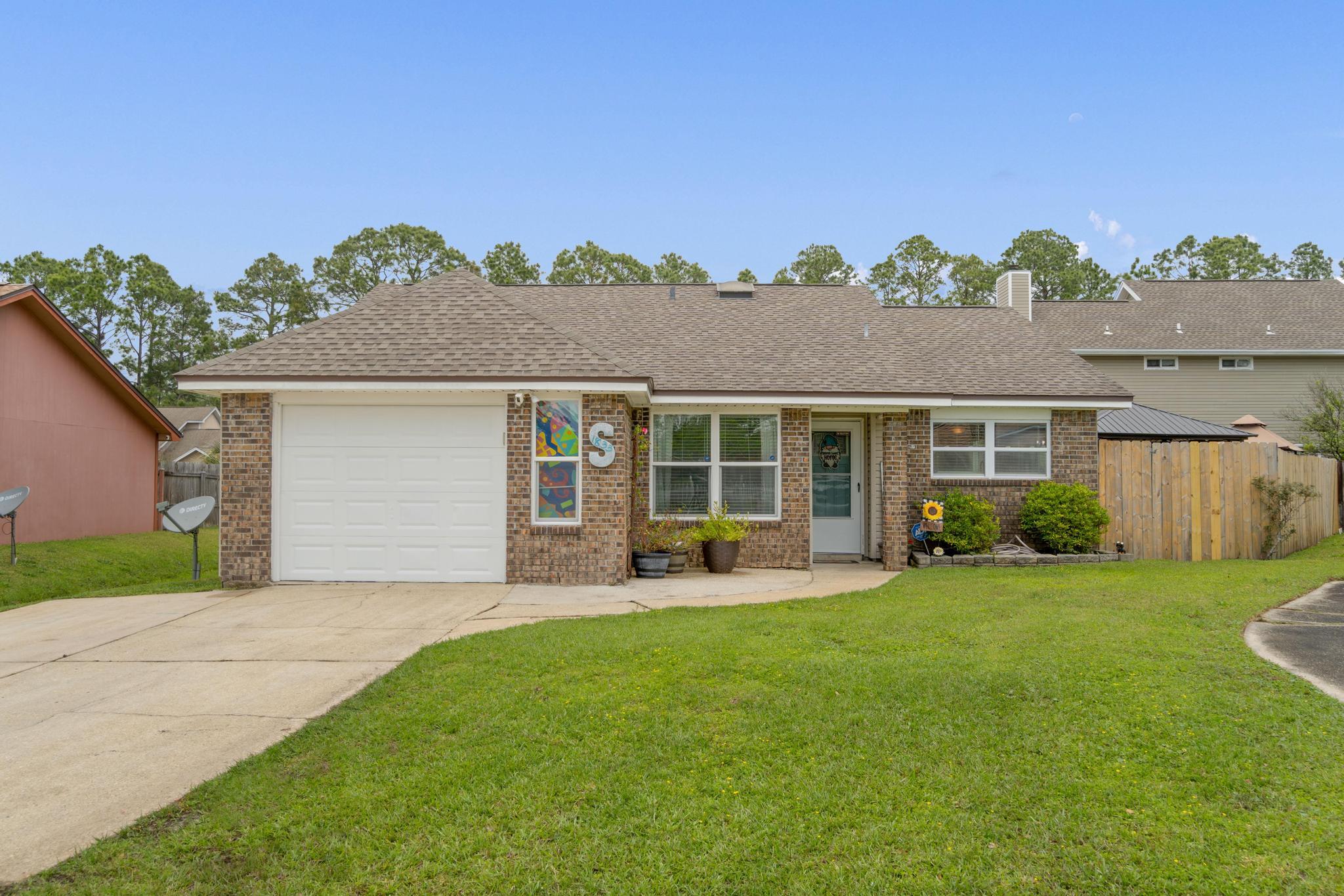 1833 Hunters Path Fort Walton Beach, FL 32547 - Photo 33 of 34 front view of a house with a yard