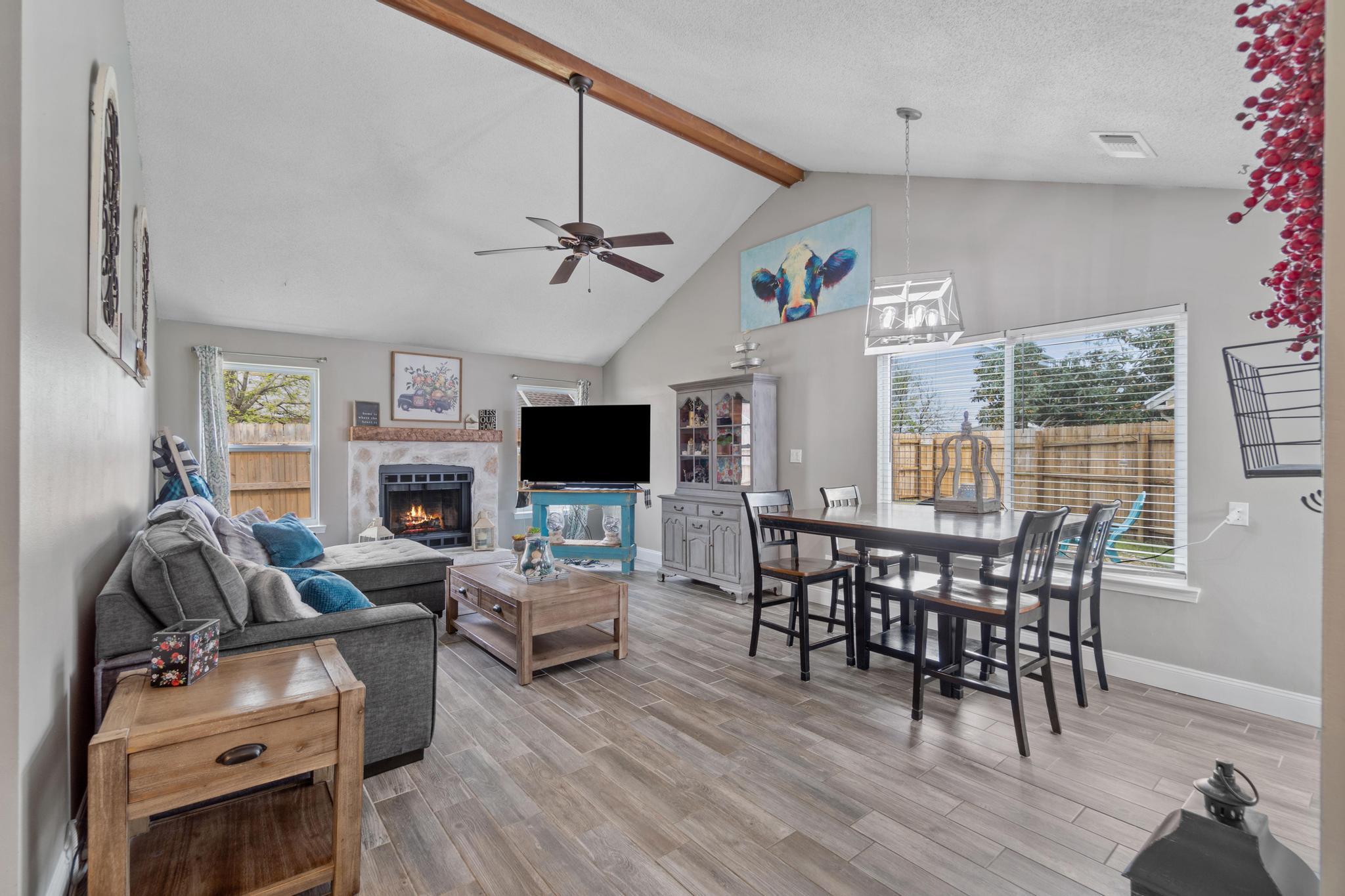 1833 Hunters Path Fort Walton Beach, FL 32547 - Photo 8 of 34 a living room with furniture a wooden floor and a flat screen tv