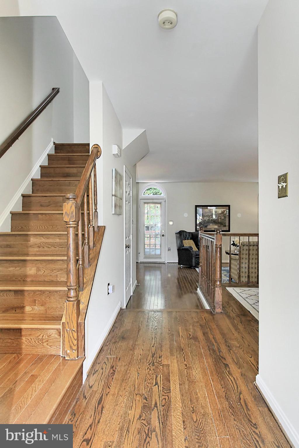 7469 Ridge Oak Court Springfield, VA 22153 - Photo 3 of 18 Golden hardwood floors on the main & upper level.