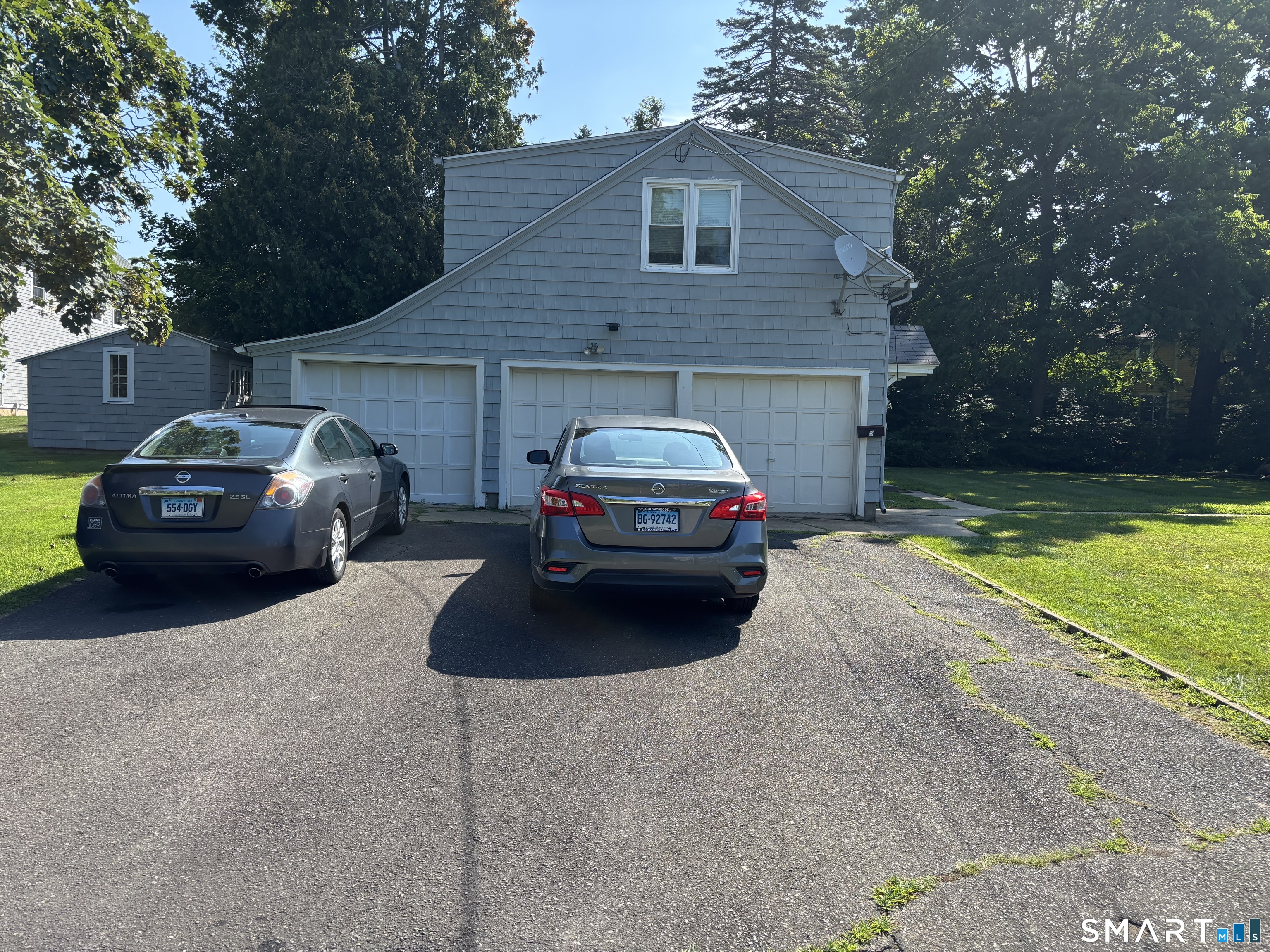 119 Old Boston Post Road Old Saybrook, CT 06475 - Photo 2 of 17 Paved Driveway with 2 spots end to end on the right side of the driveway.