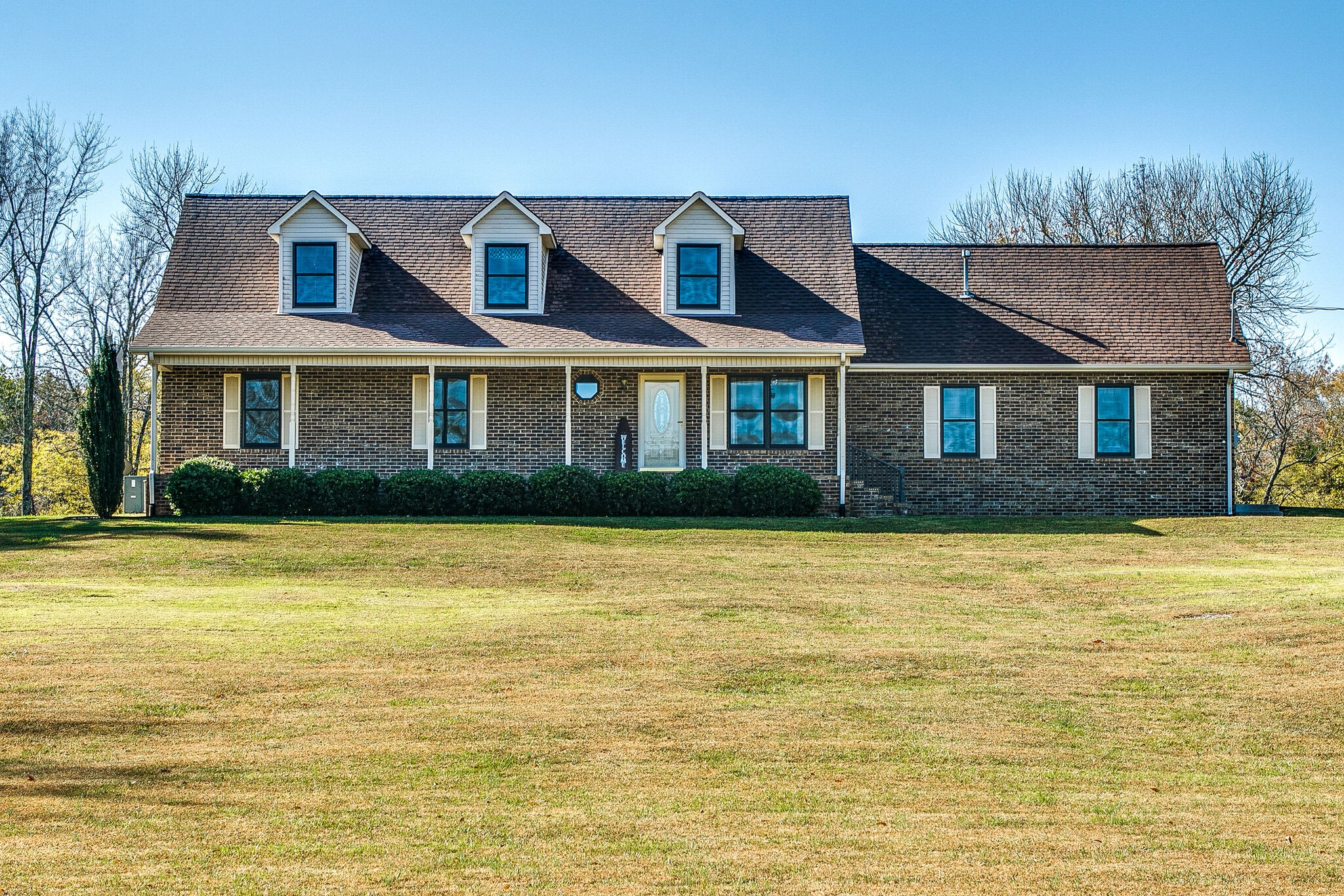 a front view of a house with a swimming pool
