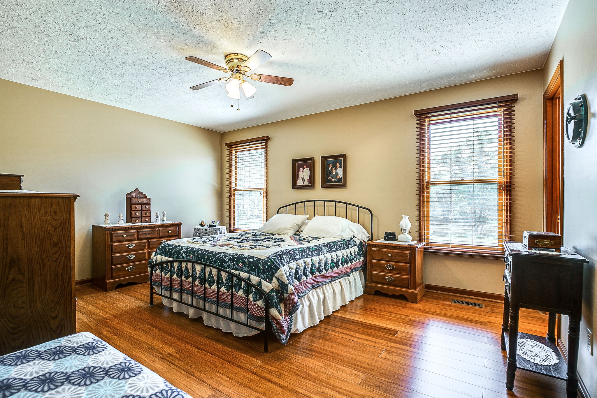 9513 Link Road Christiana, TN 37037 - Photo 18 of 34 a bedroom with a bed and a chandelier