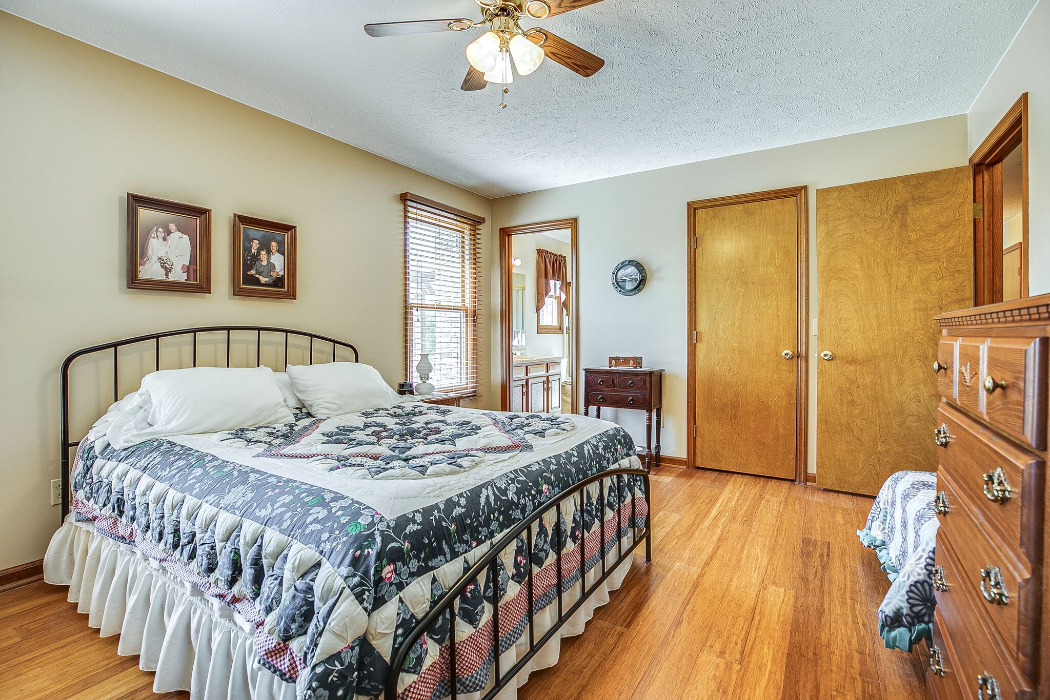 9513 Link Road Christiana, TN 37037 - Photo 19 of 34 a bedroom with a bed and a chandelier