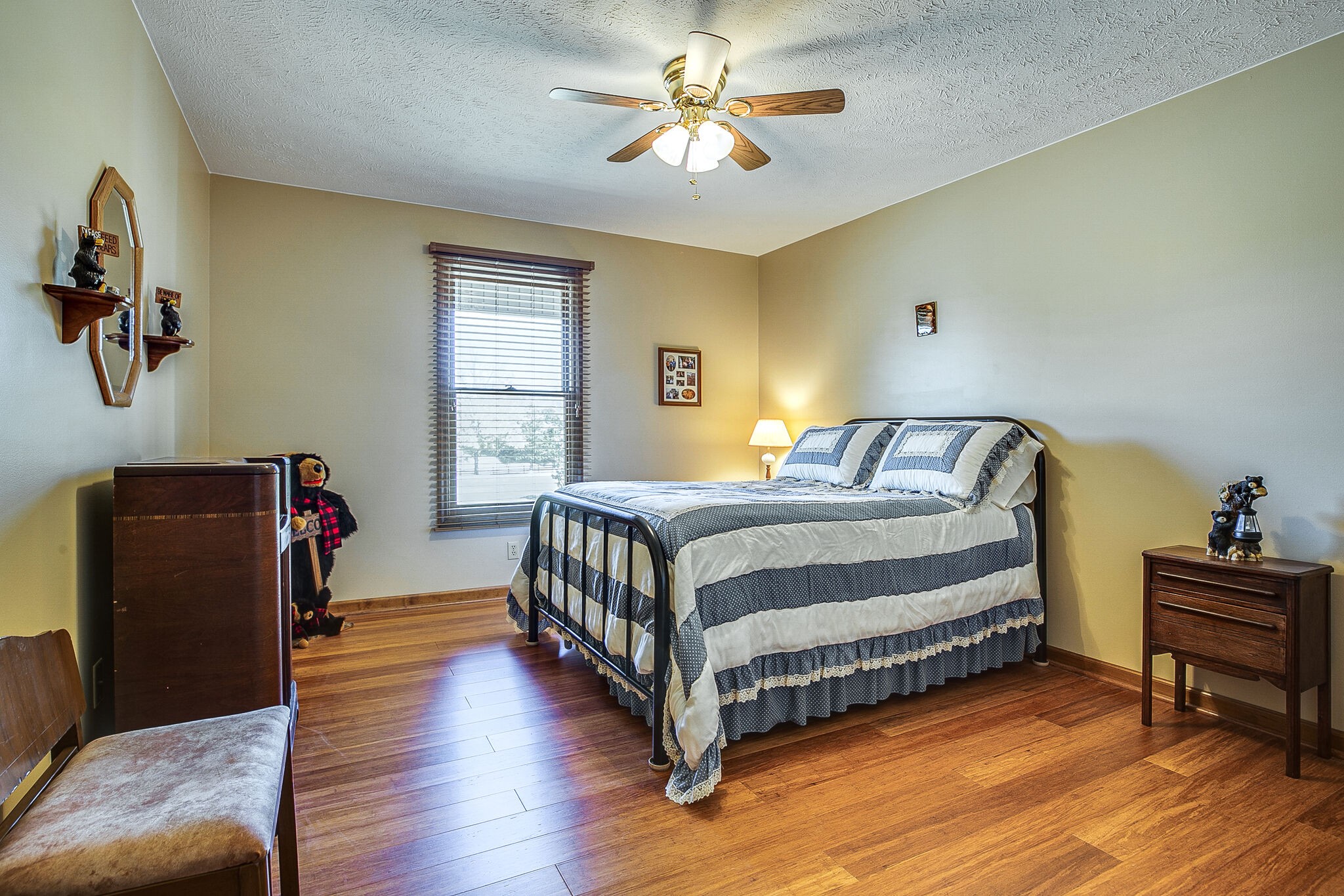 9513 Link Road Christiana, TN 37037 - Photo 21 of 34 a bedroom with a bed and a chandelier