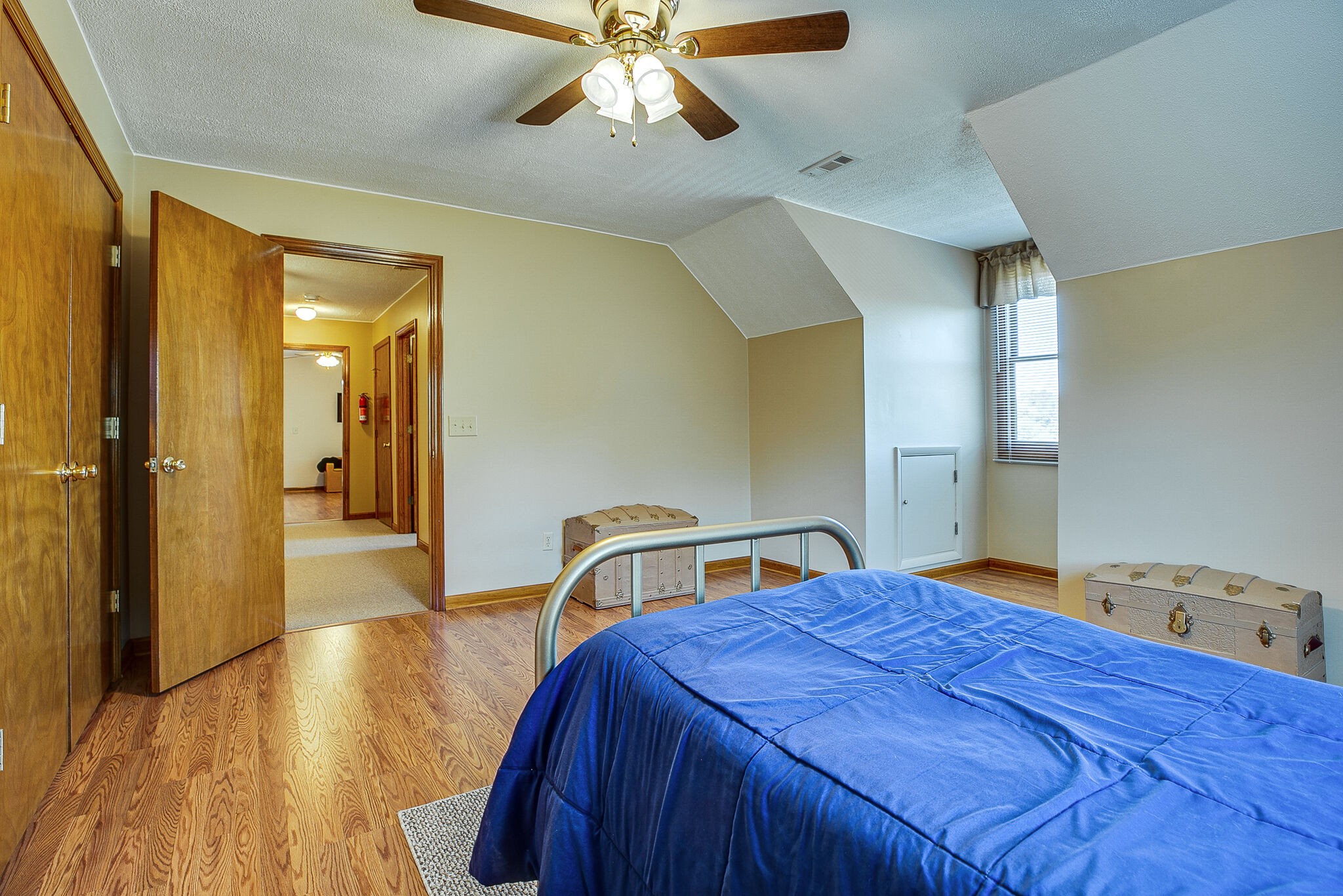 9513 Link Road Christiana, TN 37037 - Photo 23 of 34 a bedroom with a bed and a chandelier