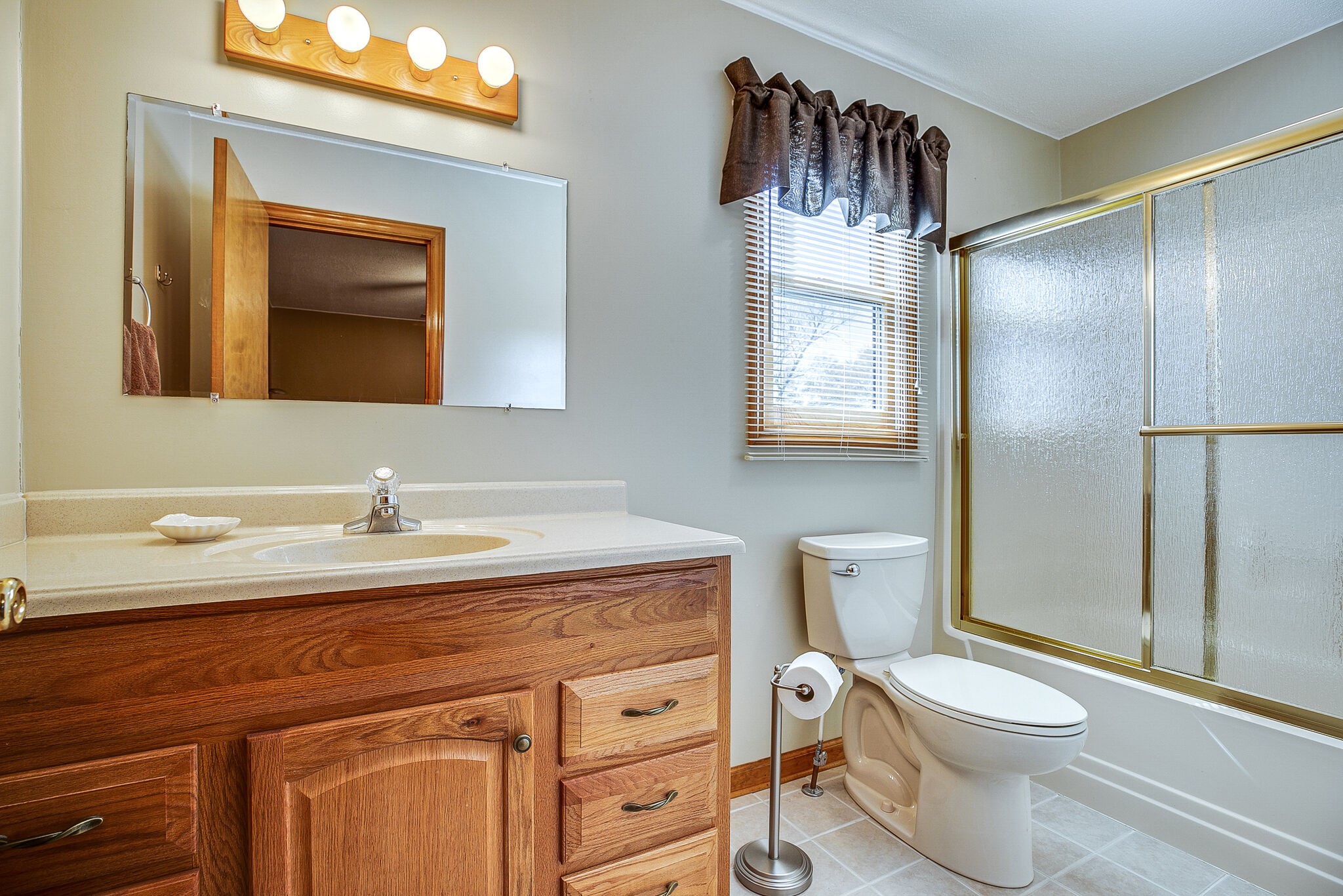 9513 Link Road Christiana, TN 37037 - Photo 25 of 34 a bathroom with a granite countertop toilet sink and mirror