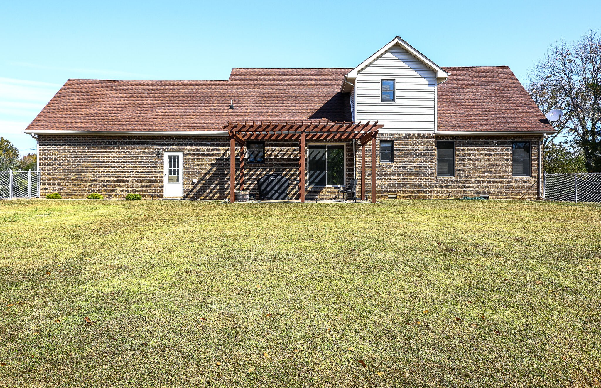 9513 Link Road Christiana, TN 37037 - Photo 32 of 34 a view of a house with a yard and a garage