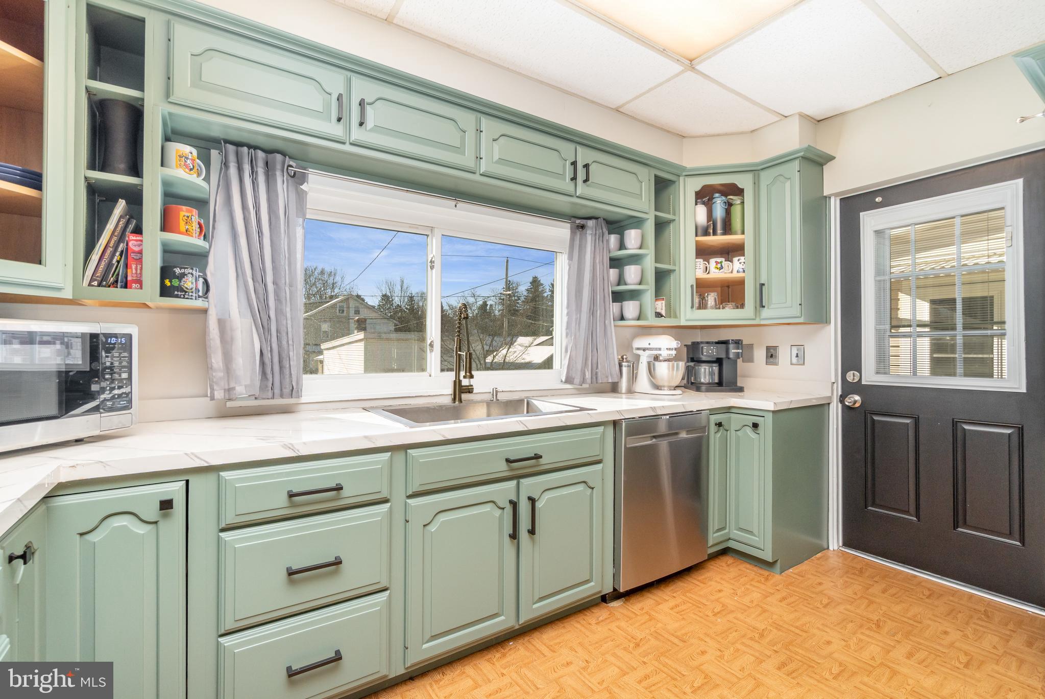 2246 Reading Avenue Reading, PA 19609 - Photo 13 of 27 a kitchen with cabinets a window and sink