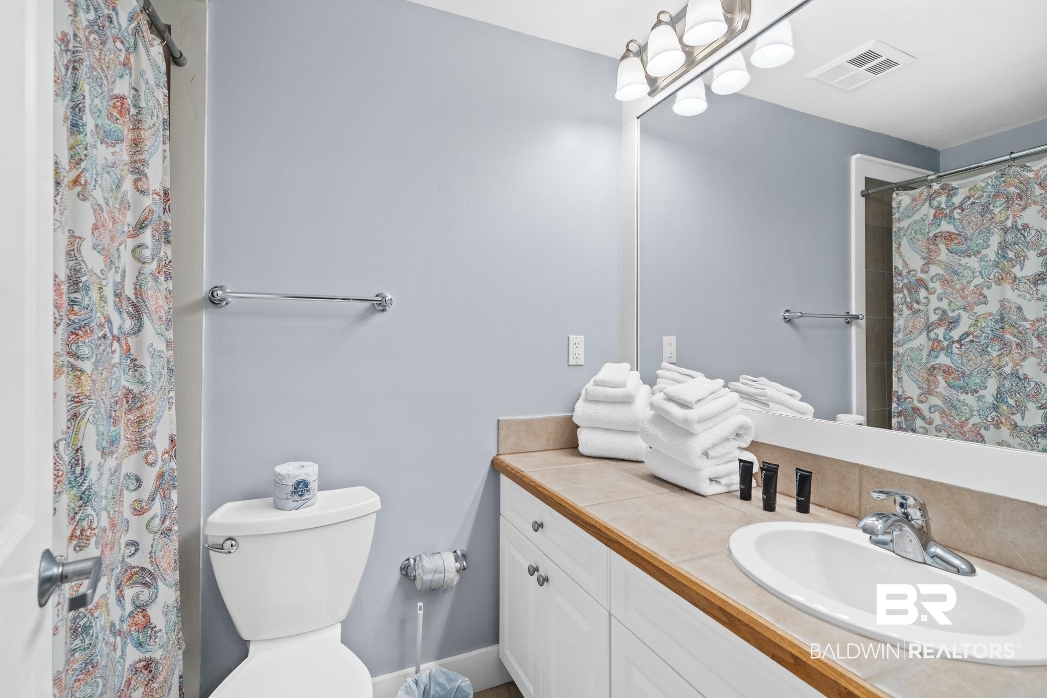 815 Plantation Road, Unit 405 Gulf Shores, AL 36542 - Photo 13 of 39 Bathroom featuring toilet, walk in shower, and vanity