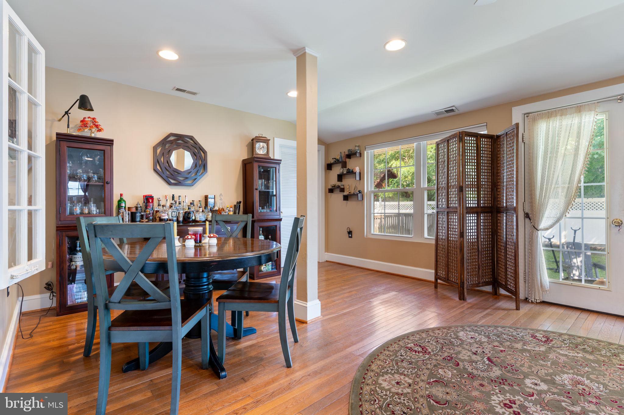 2844 Ridge Road Huntingtown, MD 20639 - Photo 14 of 47 a view of a dining room with furniture window and wooden floor