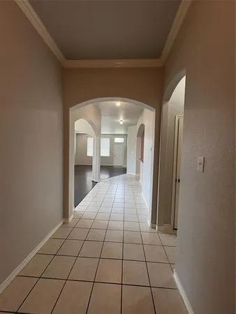 a view of a hallway with a livingroom