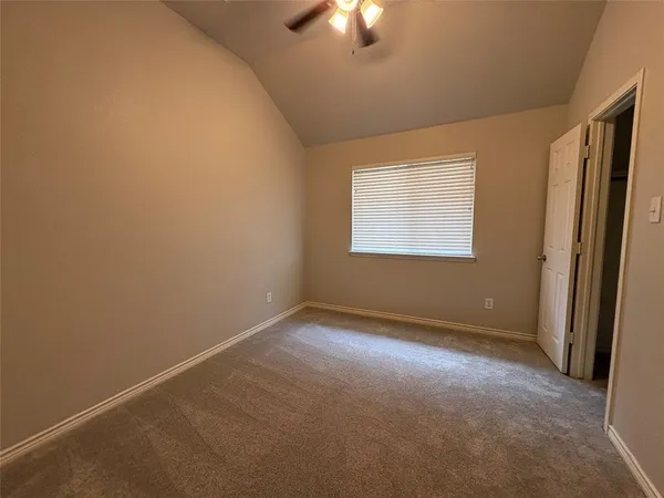 an empty room with a empty space and a window
