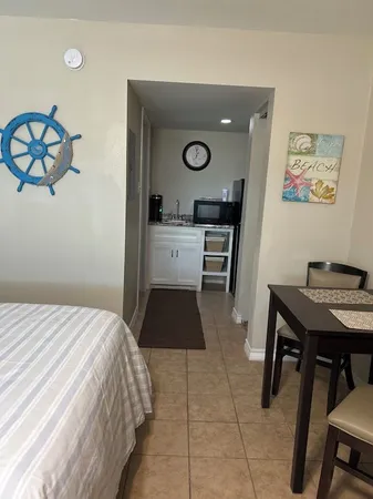 a bedroom with a bed and a table