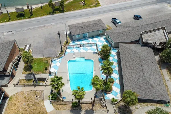 an aerial view of multiple houses with yard