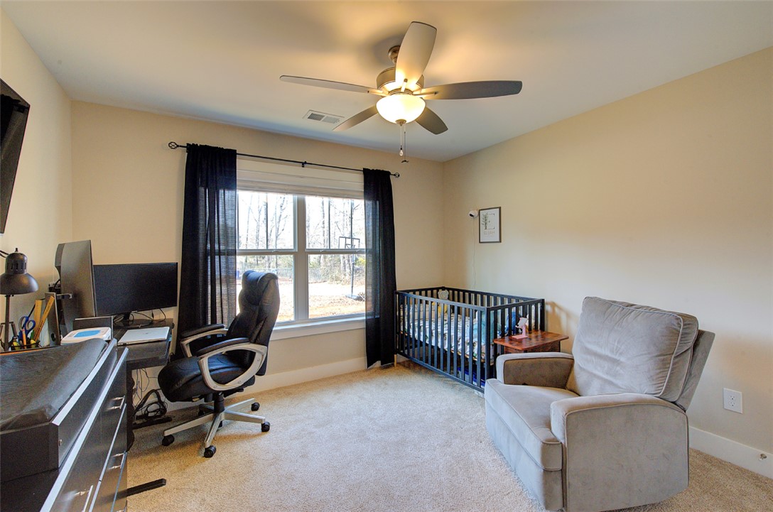 110 Sanders Drive Easley, SC 29642 - Photo 14 of 23 This versatile room offers comfort and functionality for various needs, featuring ample natural light.