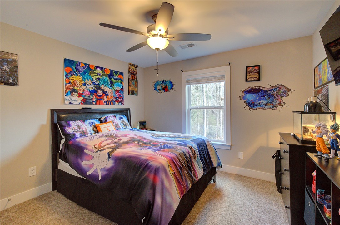 110 Sanders Drive Easley, SC 29642 - Photo 16 of 23 This cozy bedroom offers ample natural light and a comfortable atmosphere for relaxation.