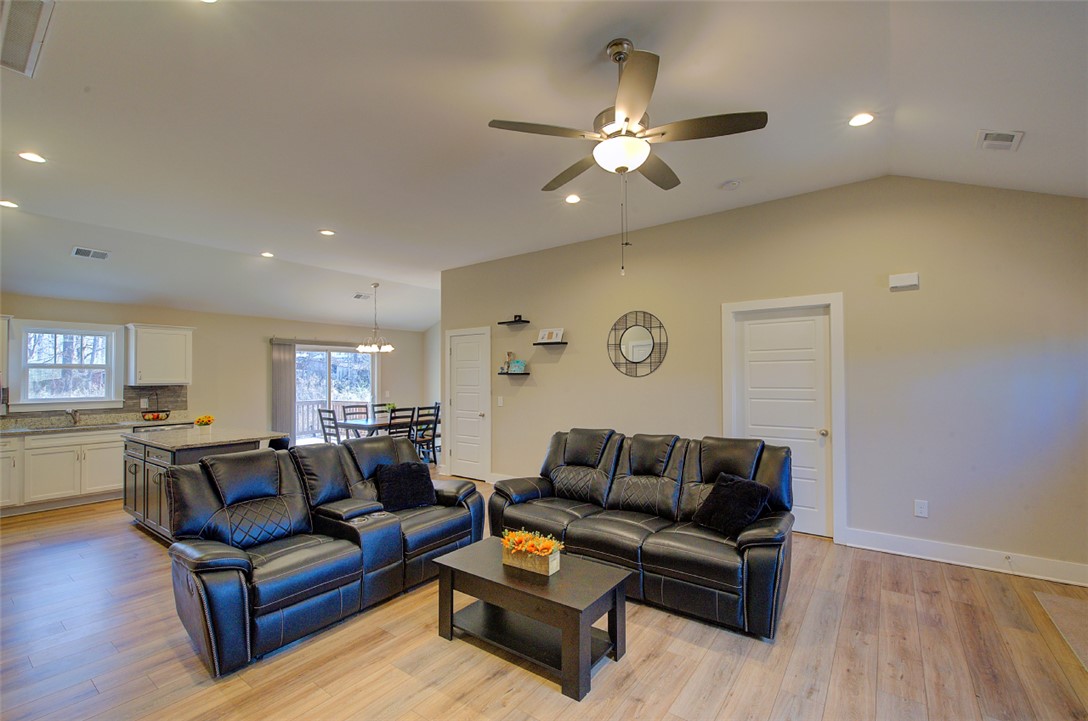 110 Sanders Drive Easley, SC 29642 - Photo 6 of 23 This bright and airy open-concept living area seamlessly connects to the kitchen and dining space.