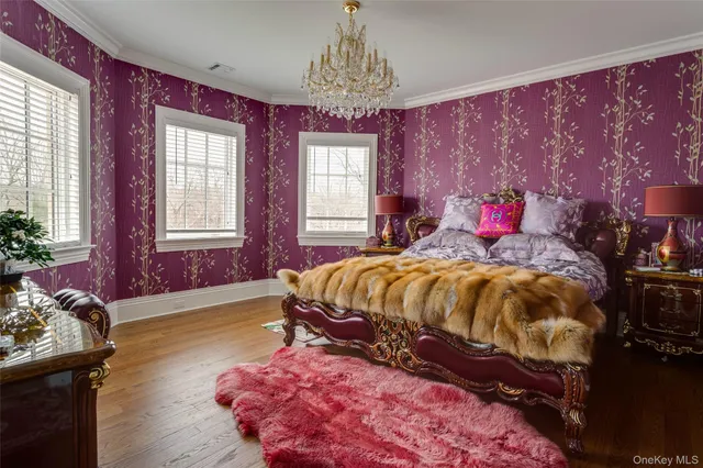 a bedroom with a bed a couch and next to a window