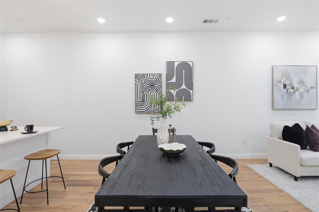 1920 Caddo Street, Unit 204 Dallas, TX 75204 - Photo 14 of 33 a view of a dining room with furniture