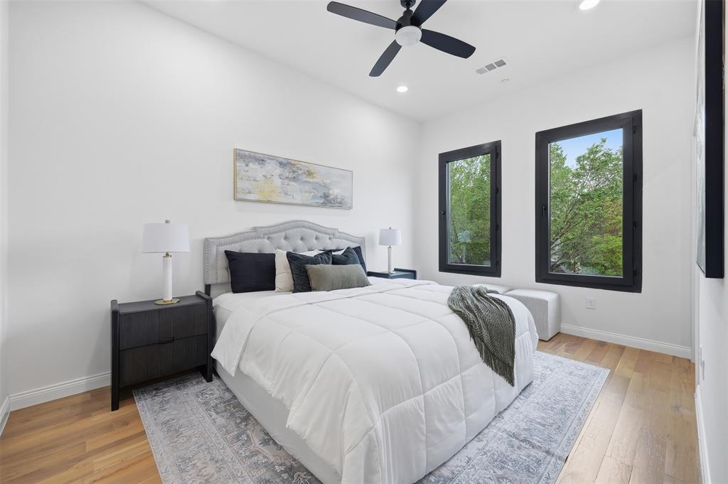 1920 Caddo Street, Unit 204 Dallas, TX 75204 - Photo 18 of 33 a bedroom with a large bed and a window