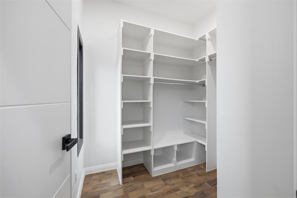 1920 Caddo Street, Unit 204 Dallas, TX 75204 - Photo 24 of 33 a view of walk in closet with empty racks