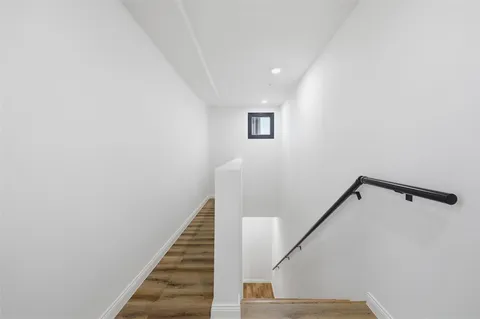 a view of a hallway with staircase