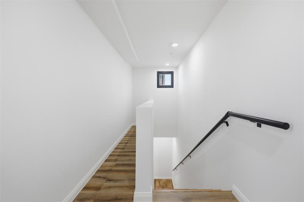 1920 Caddo Street, Unit 204 Dallas, TX 75204 - Photo 30 of 33 a view of a hallway with staircase