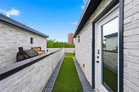 a view of balcony and yard