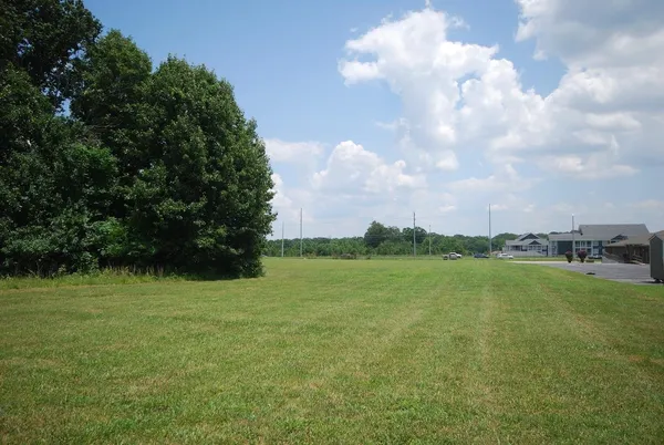 a view of a lake and a yard