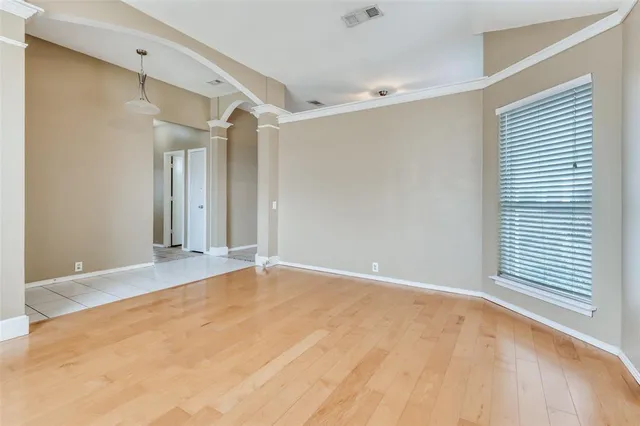 a view of an empty room and window