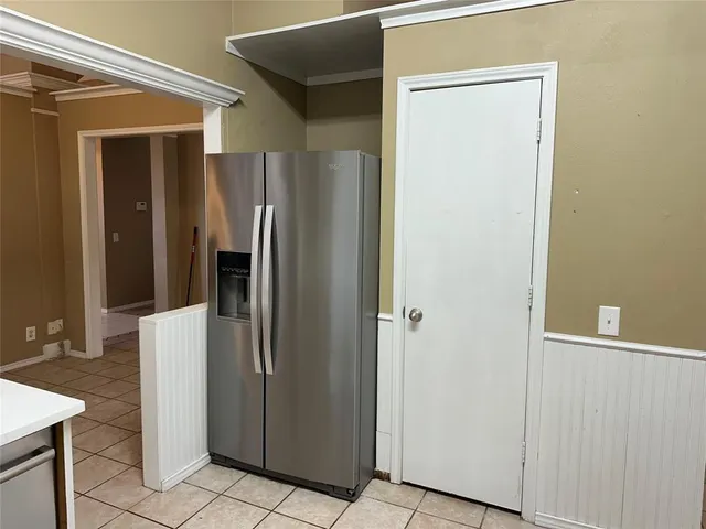 an empty room with a wooden door