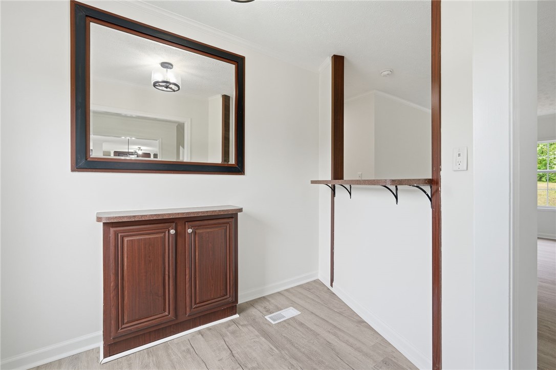112 Sir Francis Drake Way Liberty, SC 29657 - Photo 13 of 42 This bright space features sleek flooring and convenient built-in shelving, perfect for stylish organization.