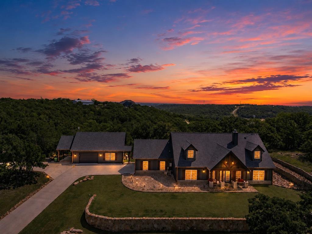 117 Ranchview Court Bowie, TX 76230 - Photo 5 of 40 a view of a big house with a big yard