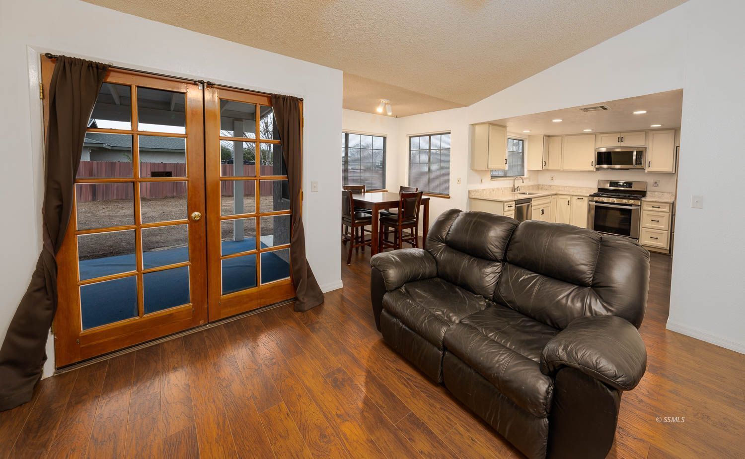 800 Valarie Street Ridgecrest, CA 93555 - Photo 11 of 39 a living room with furniture and wooden floor
