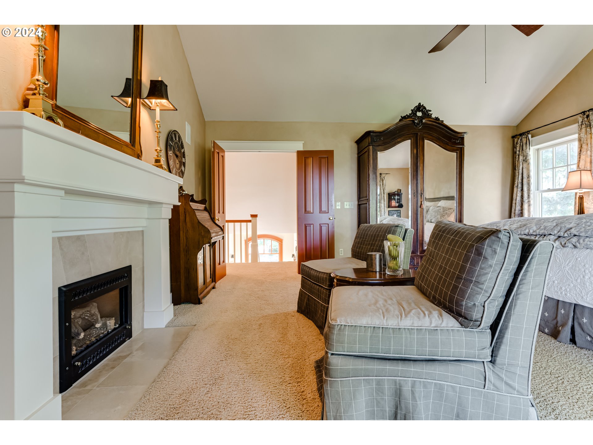 84606 Praise Lane Eugene, OR 97405 - Photo 7 of 8 a living room with furniture a fireplace and a flat screen tv