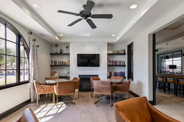 a view of a swimming pool with a patio and a yard