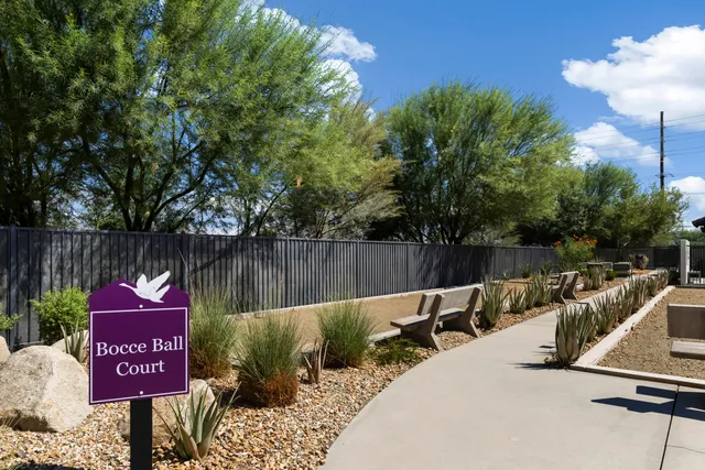 a view of a house with backyard porch and sitting area