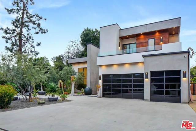 a front view of a house with a garage