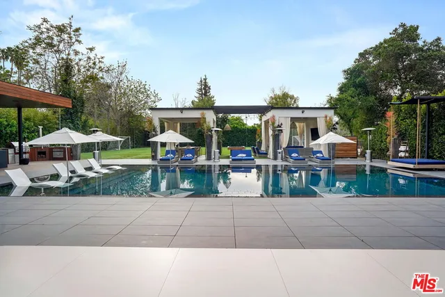 a front view of house with yard and outdoor seating