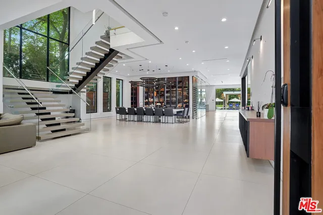a view of an entryway with wooden floor