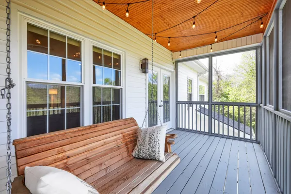 a view of a balcony with wooden floor