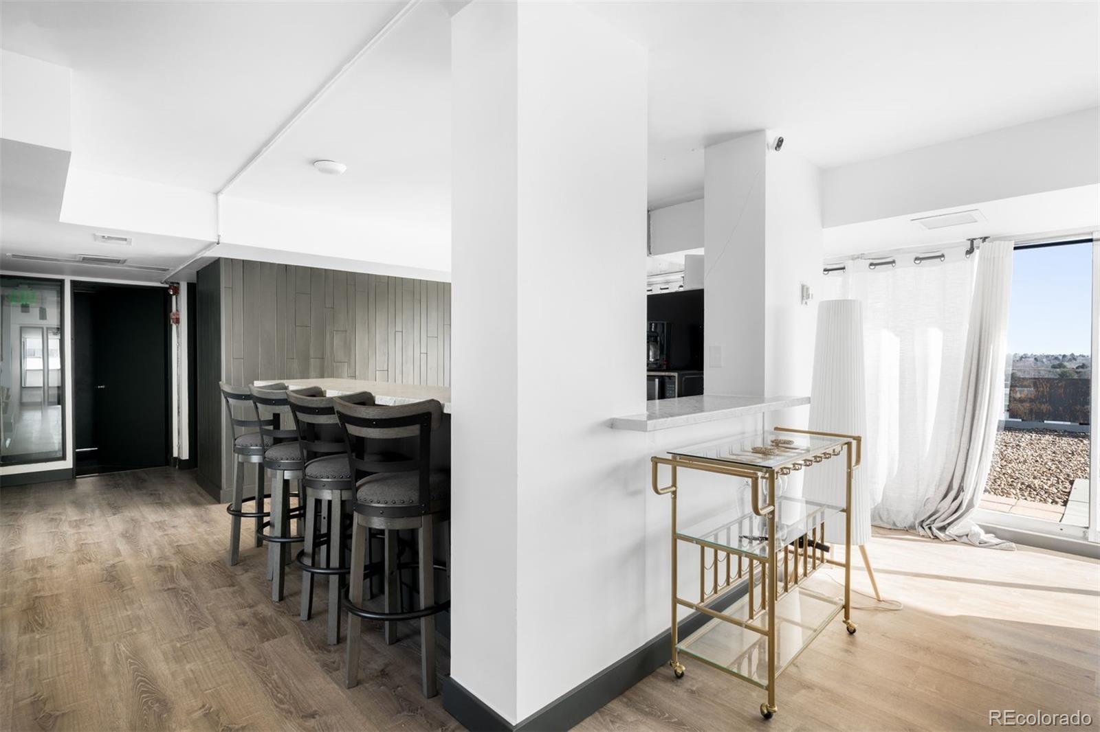1121 Albion Street, Unit 704 Denver, CO 80220 - Photo 17 of 25 a view of a dining room with furniture and window