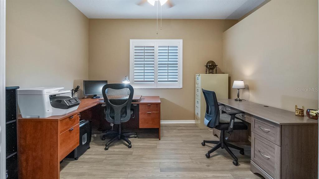 4232 Newland Street Clermont, FL 34711 - Photo 19 of 45 a view of a workspace with furniture and a window