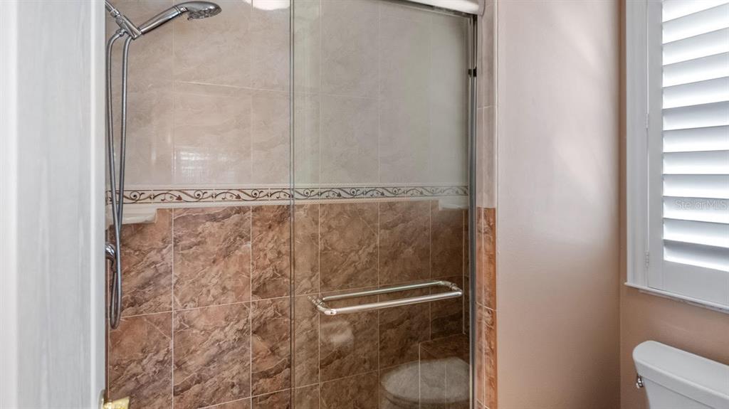 4232 Newland Street Clermont, FL 34711 - Photo 25 of 45 a bathroom with a shower