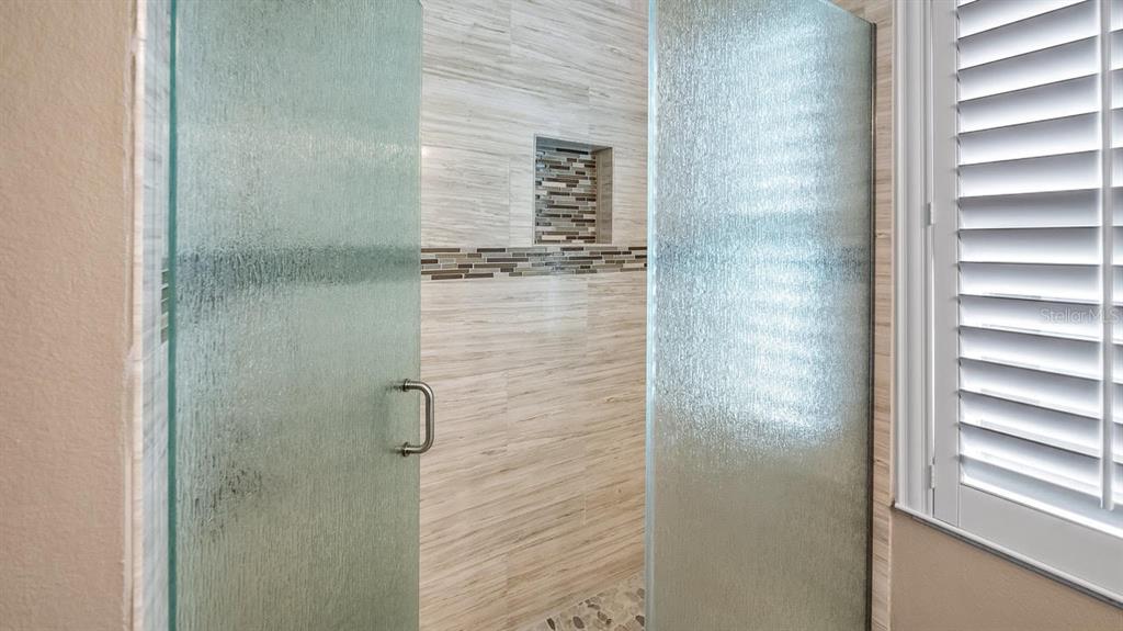 4232 Newland Street Clermont, FL 34711 - Photo 28 of 45 a bathroom with a shower