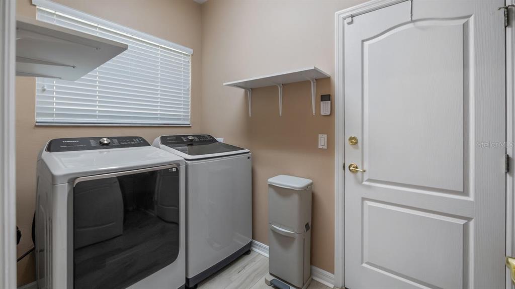 4232 Newland Street Clermont, FL 34711 - Photo 29 of 45 a utility room with dryer and washer