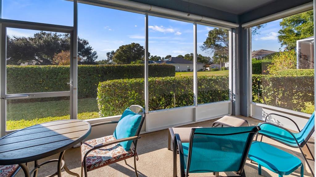 4232 Newland Street Clermont, FL 34711 - Photo 32 of 45 a view of a city from a dining room with a table and chairs