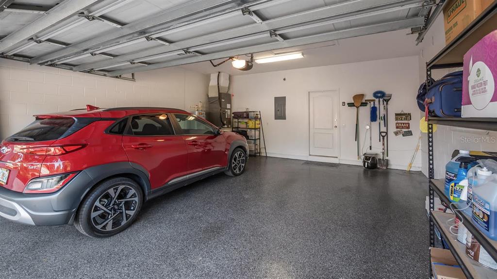 4232 Newland Street Clermont, FL 34711 - Photo 34 of 45 a car is parked in a garage